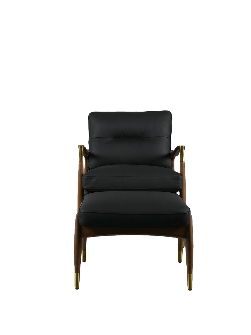Thumbnail: Curzon chair and footstool in black leather and walnut, front-facing view showing brass-tipped tapered legs and tufted seat