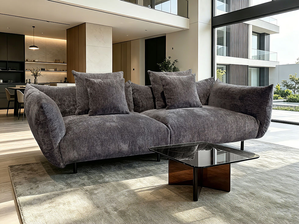 Thumbnail: Sorrento Modular Pillow Sofa styled in a spacious, modern open-concept living room with a glass coffee table.