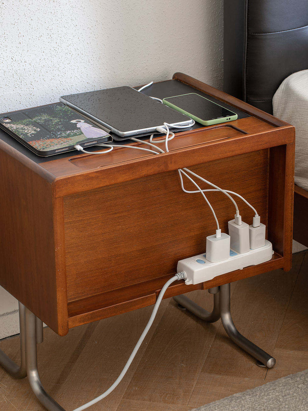 Thumbnail: Parallel bedside table with built-in device groove in use, showing a tablet and phone charging with hidden cable routing