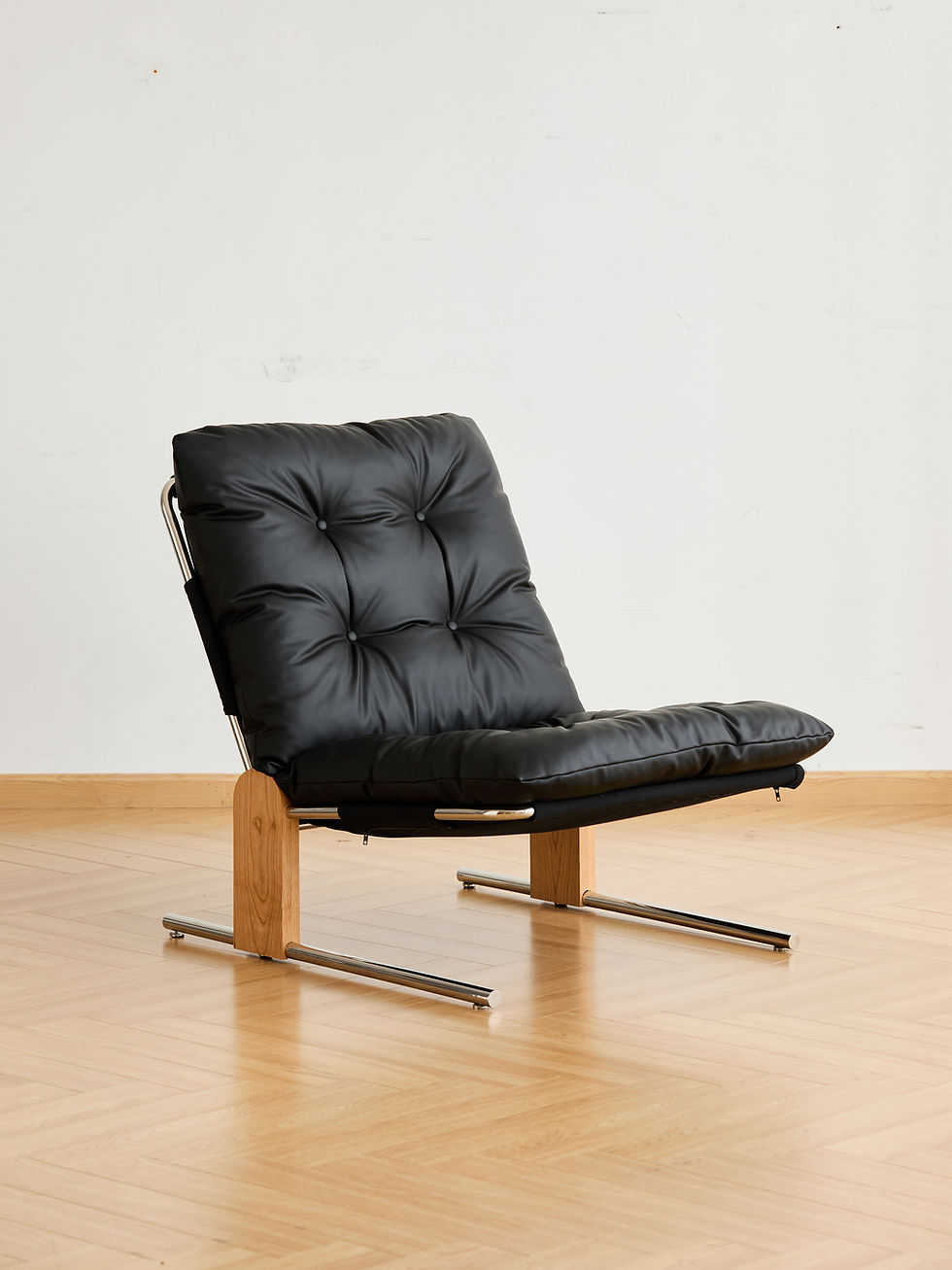 Thumbnail: Camden Leather & Chrome Lounge Chair – person sitting demonstrating deep seat comfort and chrome frame support