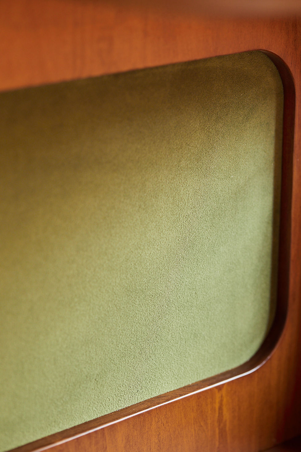 Thumbnail: Green velvet texture Close-up of the soft green velvet panel on the Orbit corner shelf