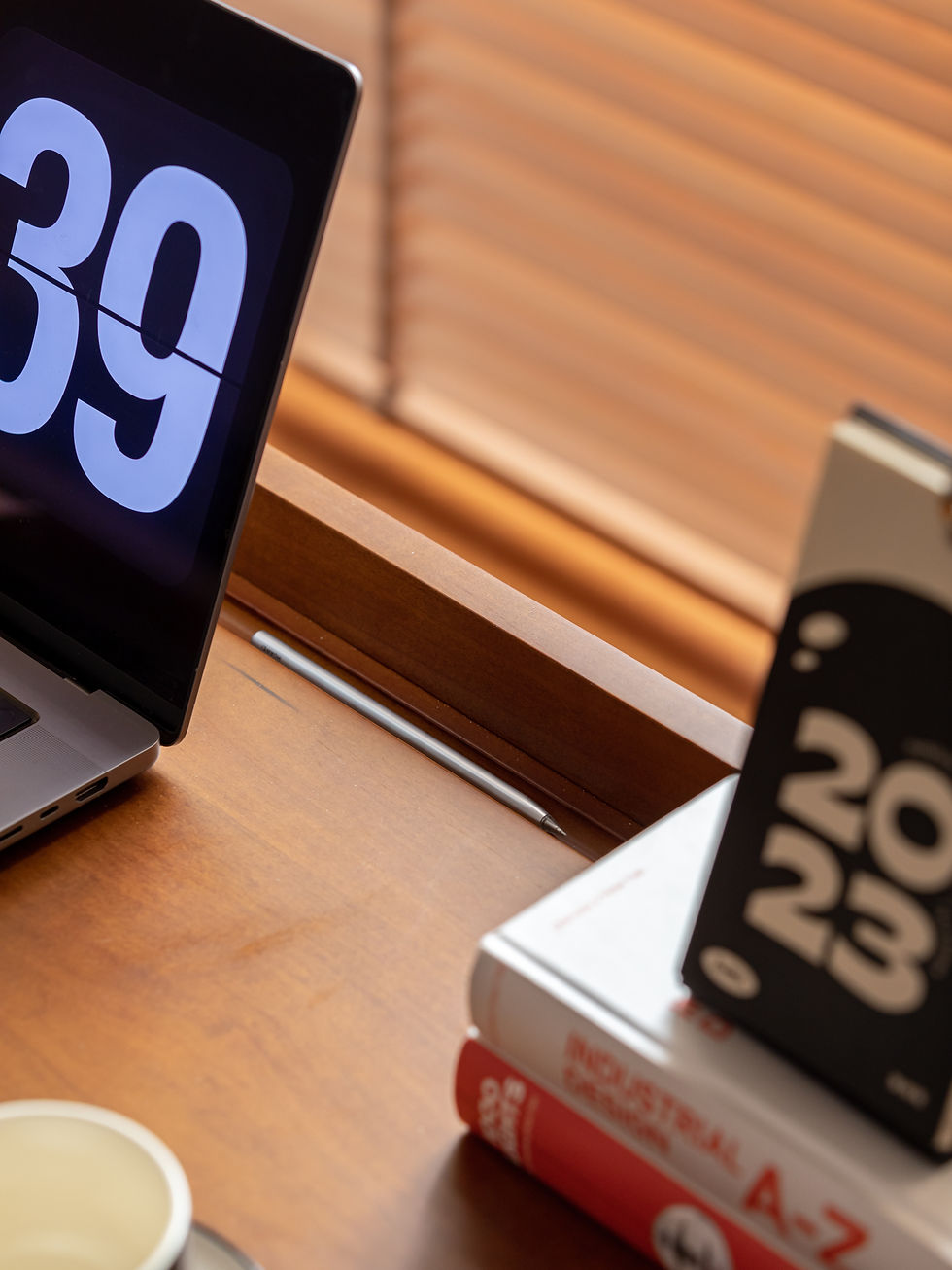 Thumbnail: Close-up of Arne Writing Desk with modern black and brass lamp, calendar and stationery