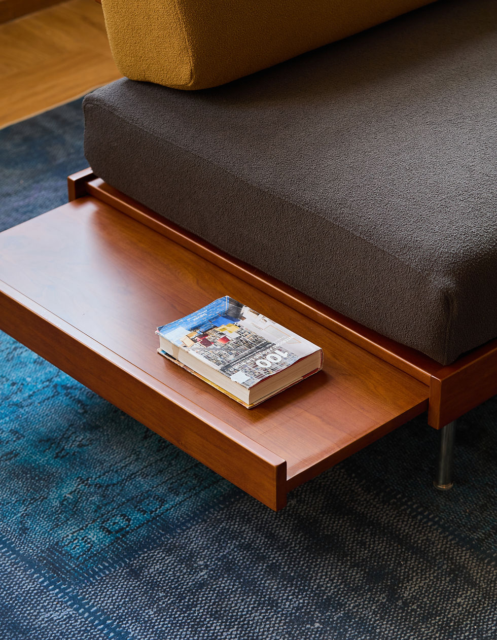 Thumbnail: Helsinki Sofa – slide‑in side table extended, displaying books and decor
