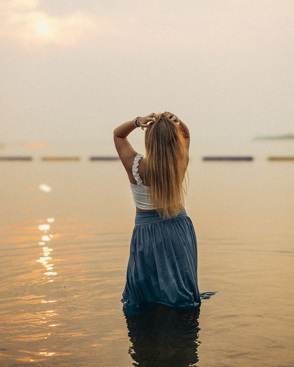 Woman at sunset for wellness and energy healing