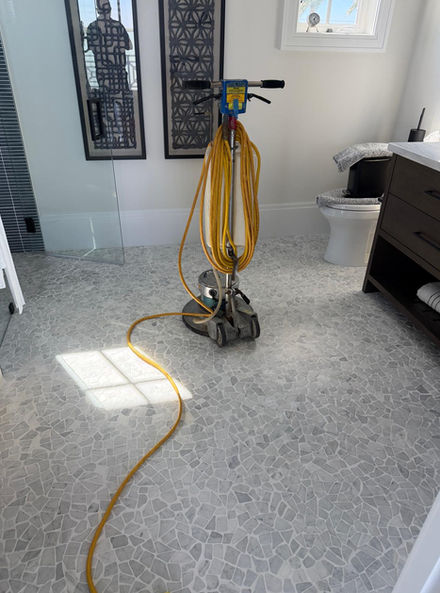 Tile cleaning on a restroom floor 
