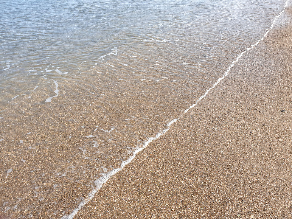 Tranquil sea lapping sand