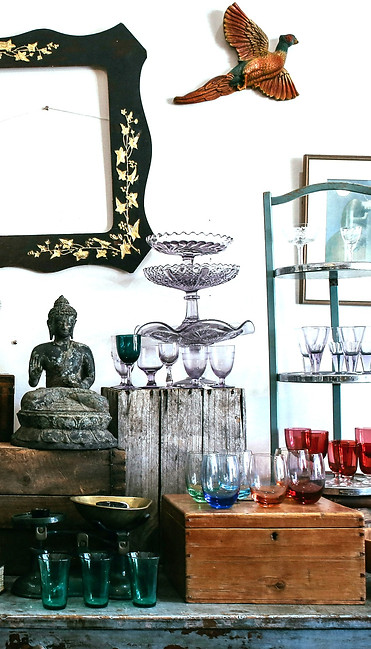 A picture of assorted curios and trinkets in a home setting