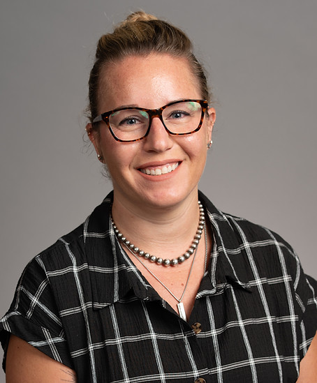 Profile picture of me, a woman with glasses, smiling