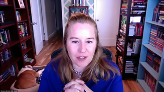 Myself, a woman with long hair, speaking on a zoom call