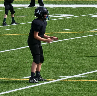 Kidzz Helping Kidzz Rising Star, Logan Hill, demonstrates teamwork and problem-solving skills while having fun fighting food insecurity among youth.