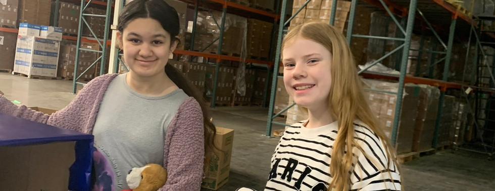 Stacked food boxes ready for delivery, results of the kidzz helping kidzz food drive