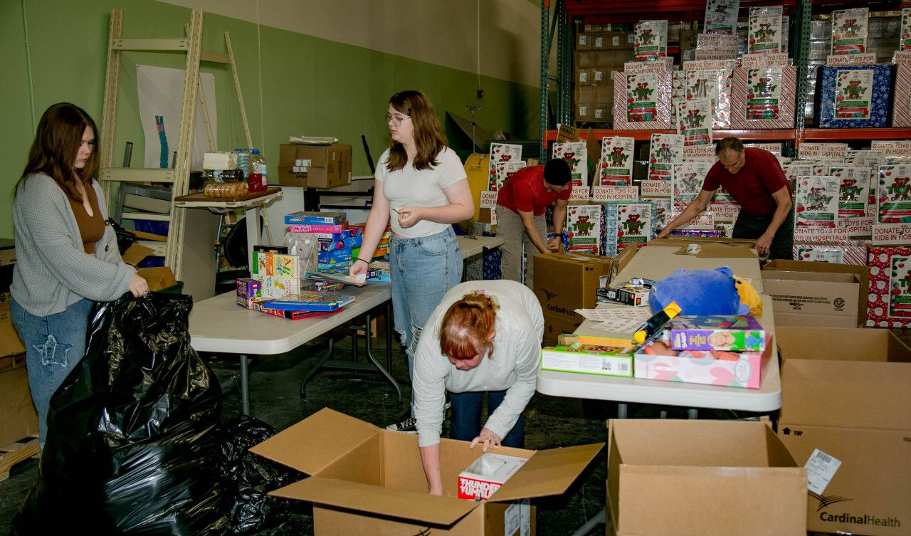 Kidzz Helping Kidzz toy sorting party 2023 digging through donations