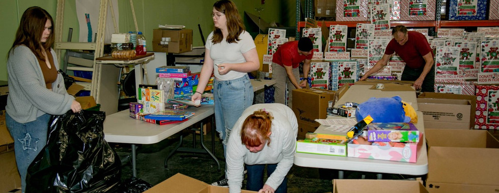 Kidzz Helping Kidzz toy sorting party 2023 digging through donations