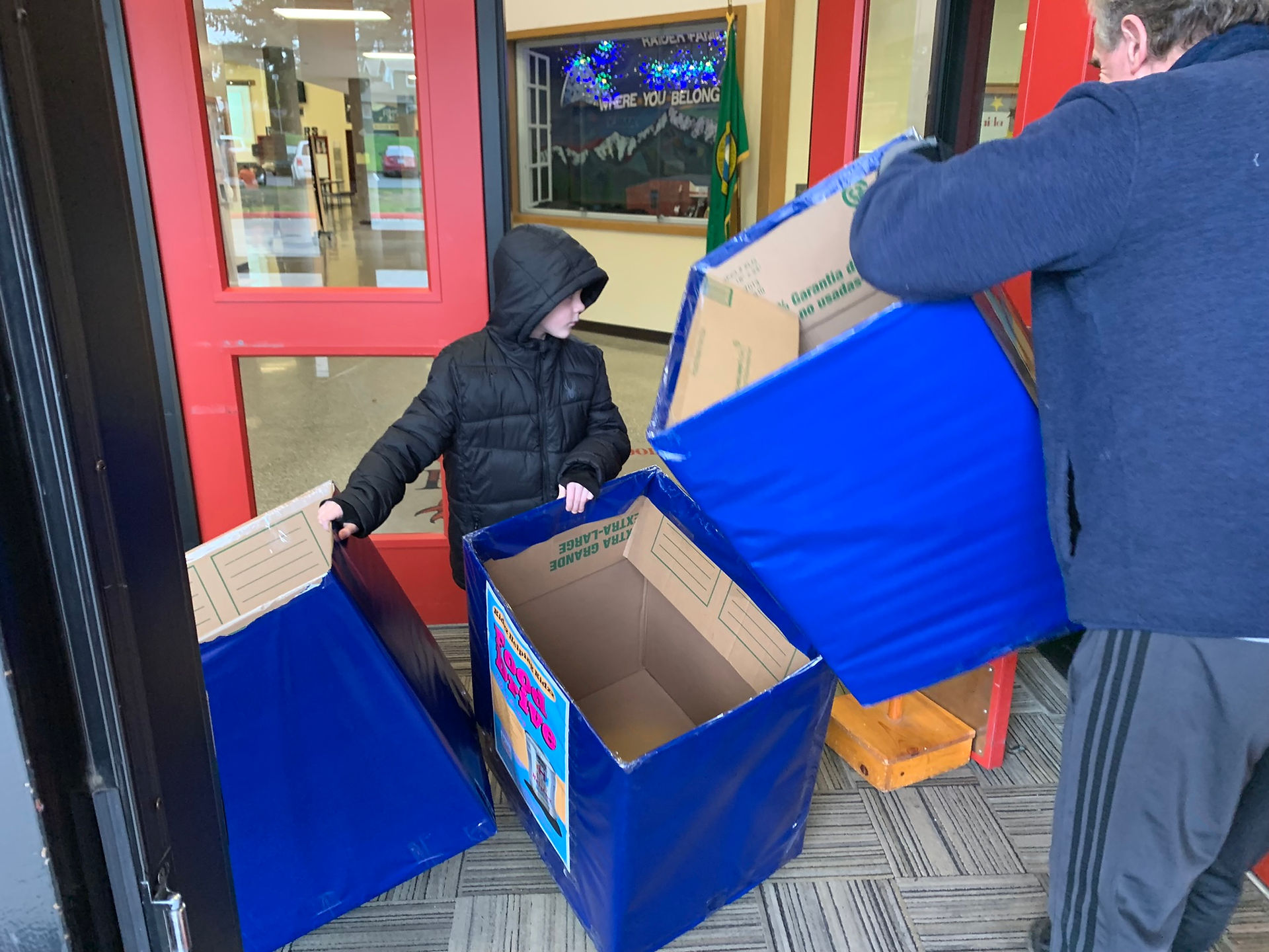 Kids and adults collaborating to support the kidzz helping kidzz food drive.