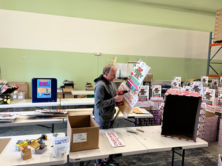 Take a peek at our toy drive preparation process, from box cleaning to festive wrapping