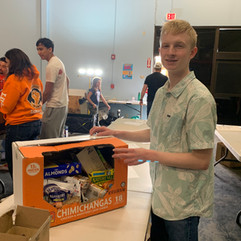 food drive sorting party social impact team building neighborhood care
