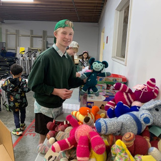 Kidzz Helping Kidzz Volunteers counting toy gifts at St Michael Medical Center