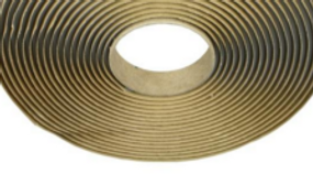 Roll of butyl caulking tape used to create weather-resistant seals between steel building panels.