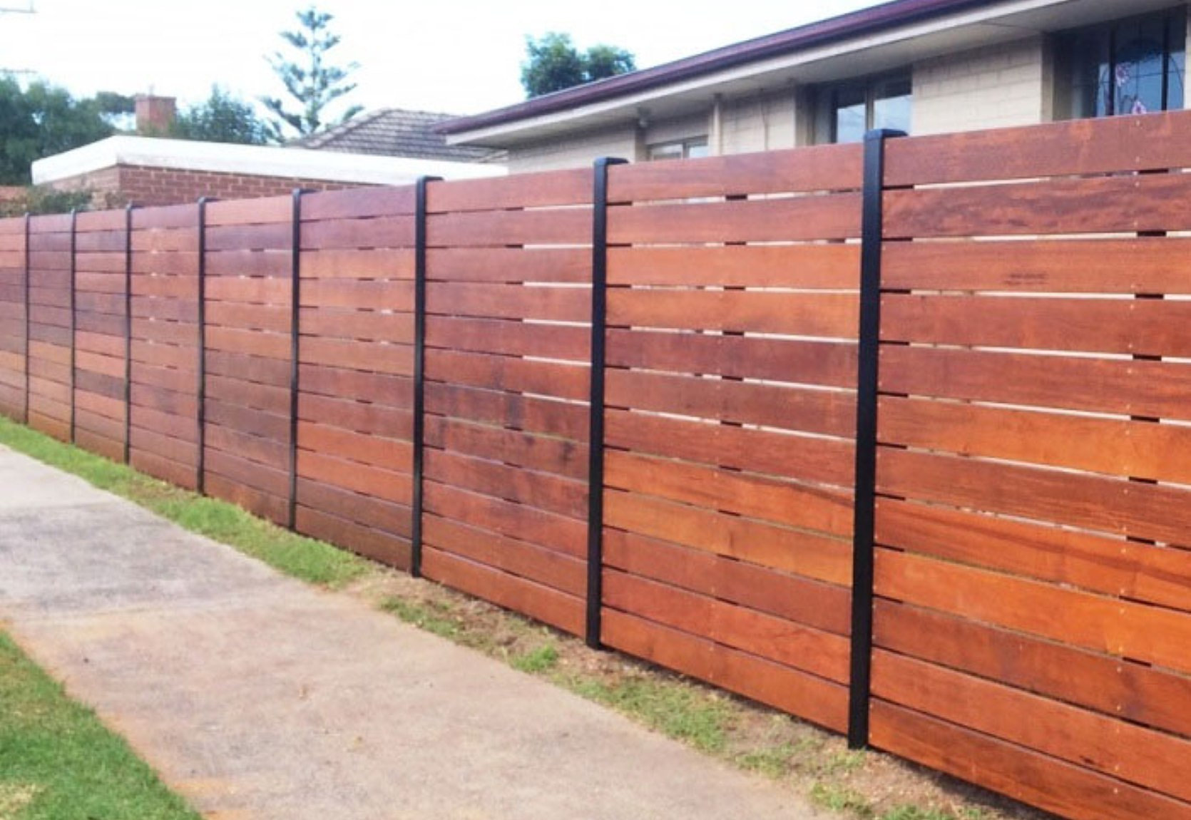 South Tweed Fencing, Timber and Aluminium Stained Merbau Slat Fence