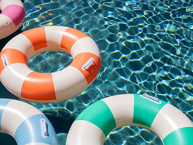 Pool photo with striped inflatable rings