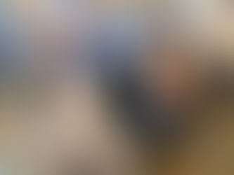 Volunteers feeding baby goats