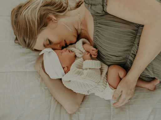 new mom with newborn baby in newborn photography