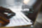 Close up of hands using laptop with abstract text on blurry background