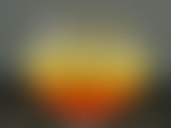 Foto de la bebida, que tiene arriba un color amarillo, y pasa con un degradado a un color coral