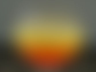 Foto de la bebida, que tiene arriba un color amarillo, y pasa con un degradado a un color coral