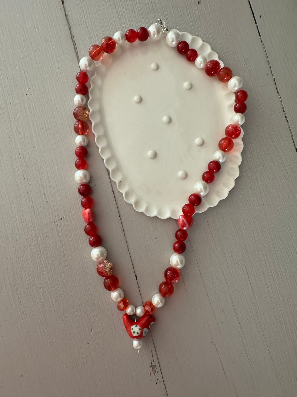 Thumbnail: Pearly red bird necklace 