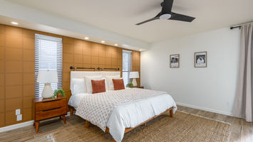 Bedroom with bed, pillows, and nightstands. Daytime Photography. phoenix real estate photographer
