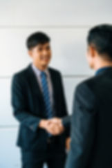 business-people-handshake-agreement-office-uds.jpg