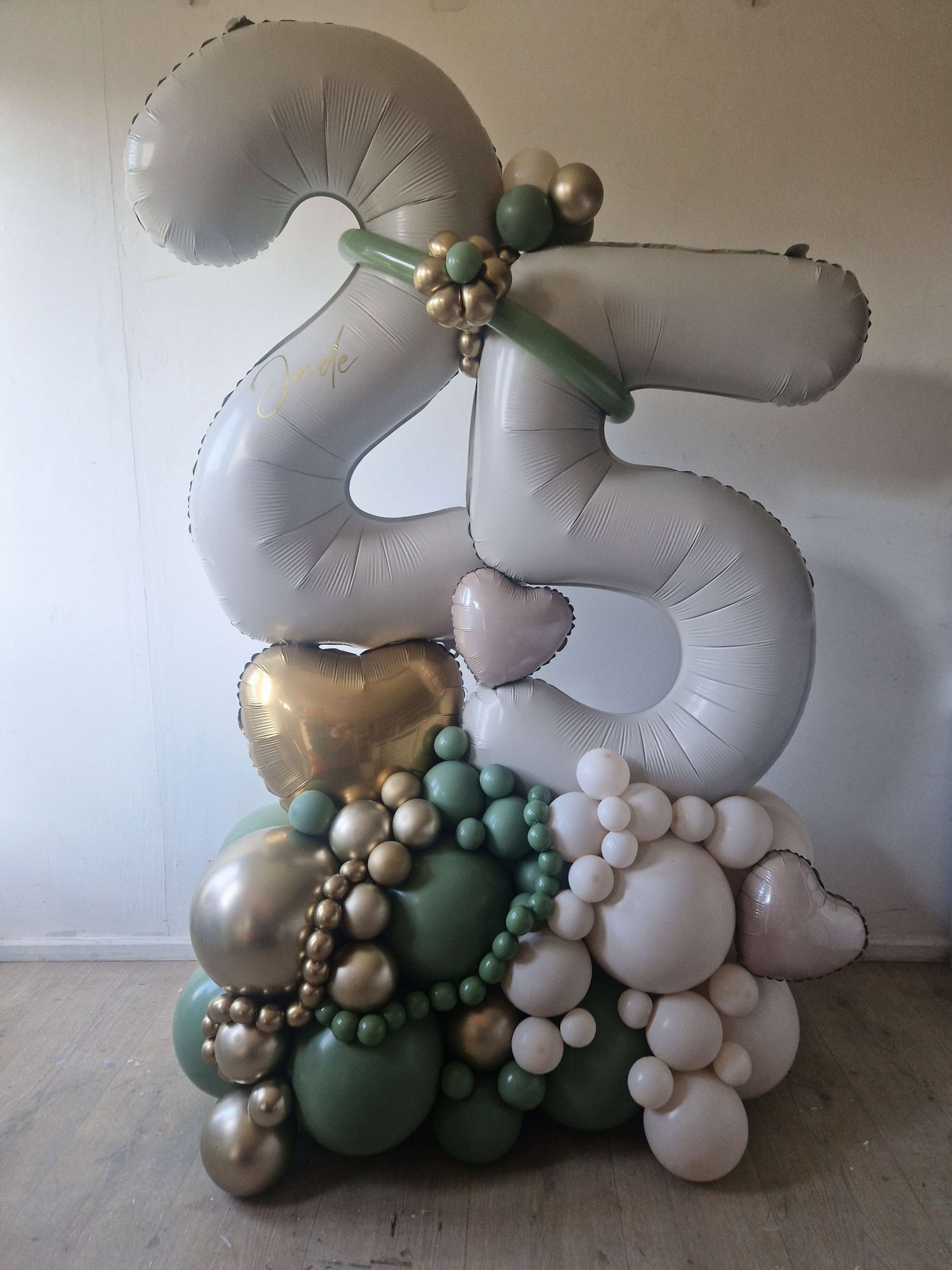 white and green 25th balloons