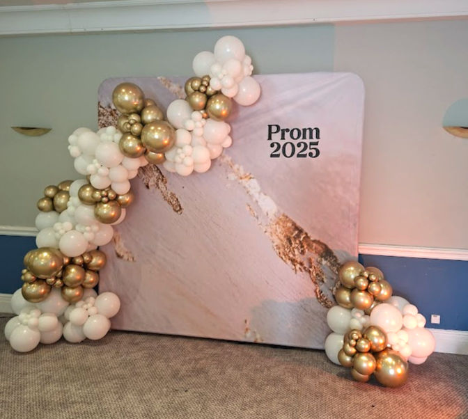 Marble backdrop and balloons for a prom in Elstree