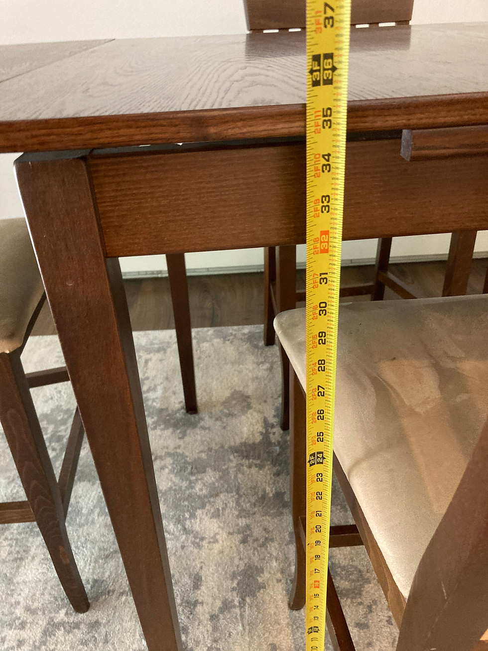 Thumbnail: Tall wooden dining table with three stools