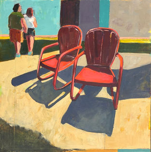 Two empty chairs casting shadows as two people walk away