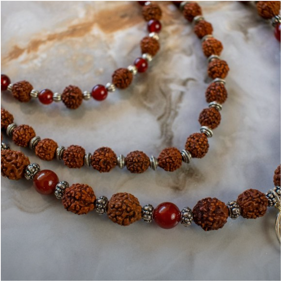 Thumbnail: Rudraksha Beads with sterling silver trident and carnelian beads