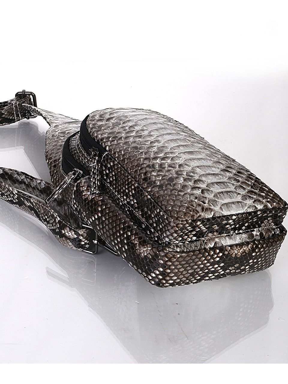 Thumbnail: A python leather sling bag.