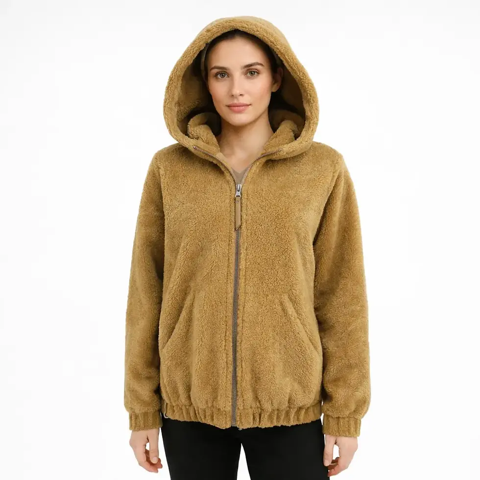 A woman wearing a hooded shearling jacket, front view