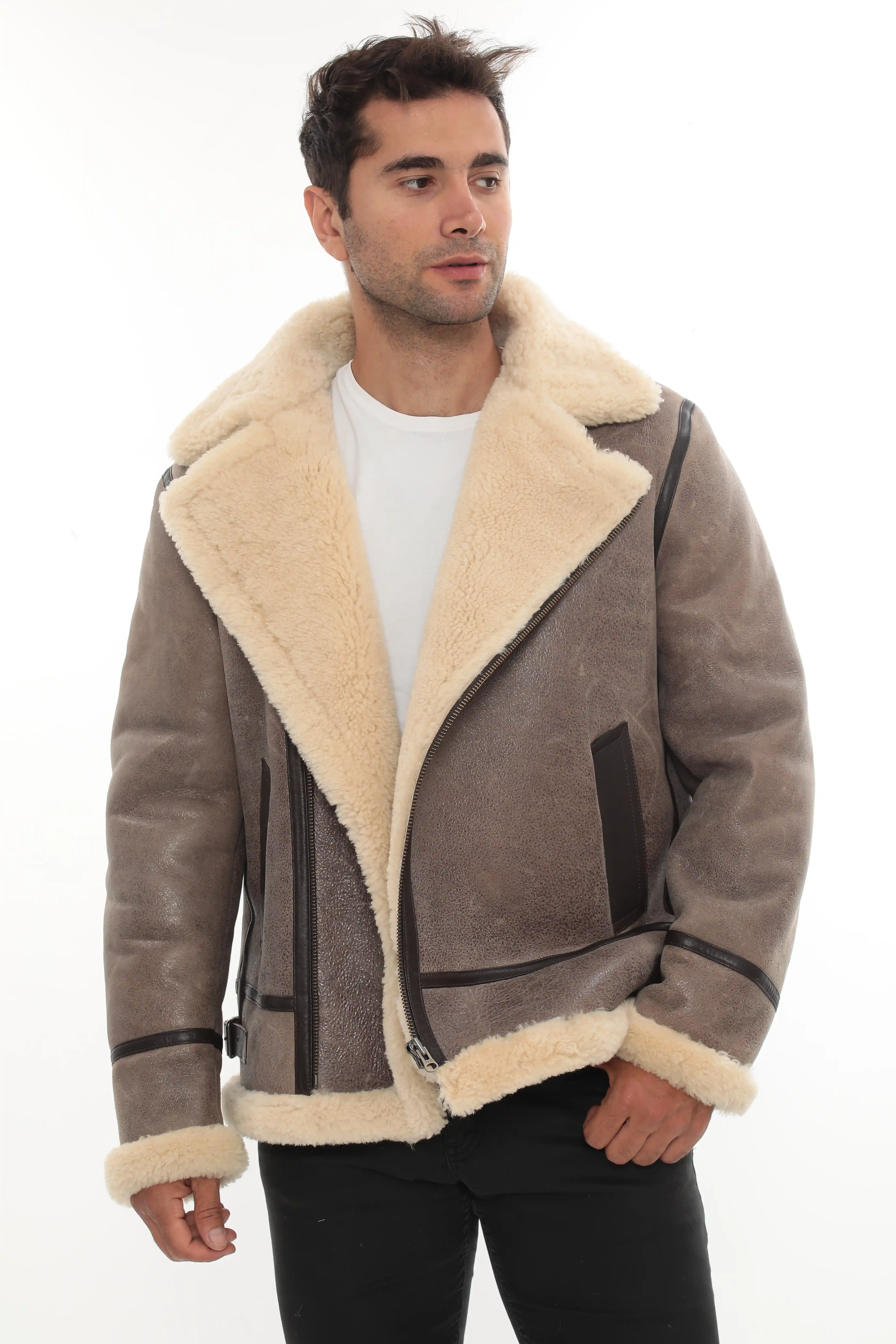 A man wearing a taupe brown shearling jacket, front view - By Kani.