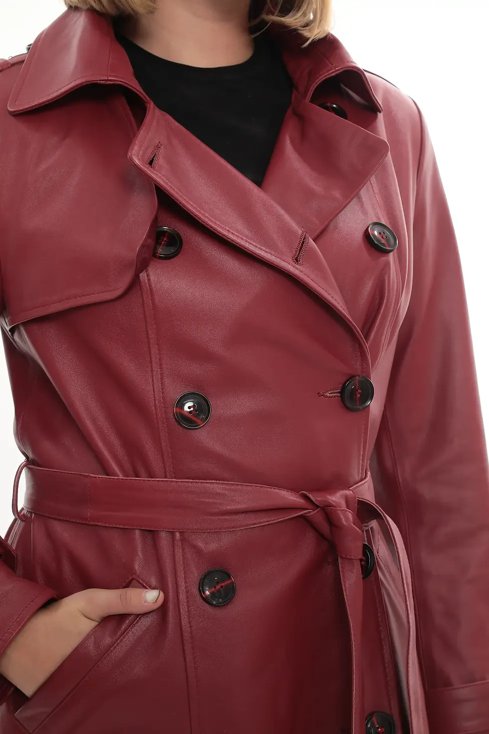 Thumbnail: A woman wearing a cherry red long leather trench coat, close up view — By Kani.