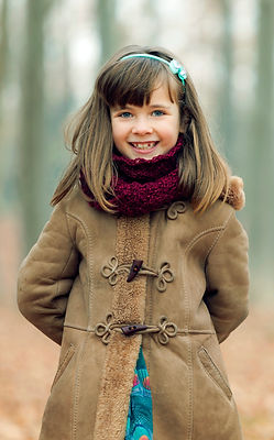 smiling girl coat and scarf