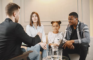 family-counseling-session-home-with-therapist-pshycologist-showing-pictures-emotions-girl-