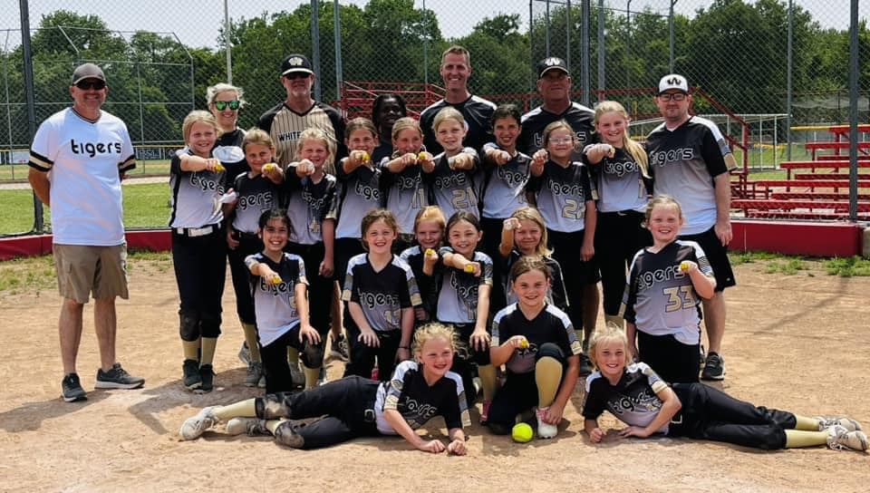 Youth softball team in custom uniforms