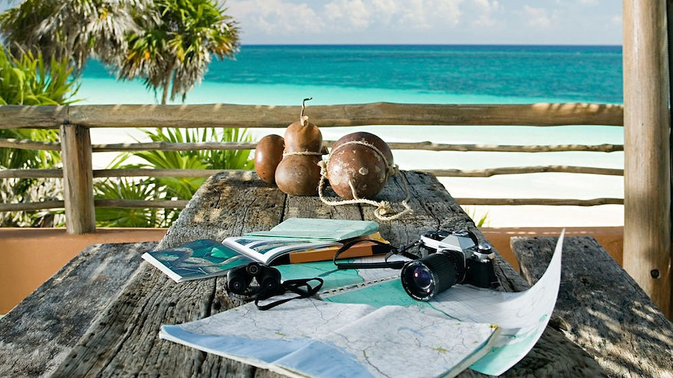 Maps and important documents on a table by a beach