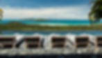 Amazing view of the ocean, islands and infinity pool. In front there are sunbeds with rolled towels in the bathing sun.