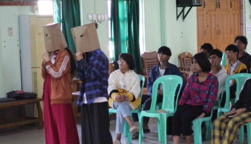 Participants engaging in voice acting exercise
