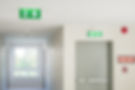 Fire exit sign with light on the path wa