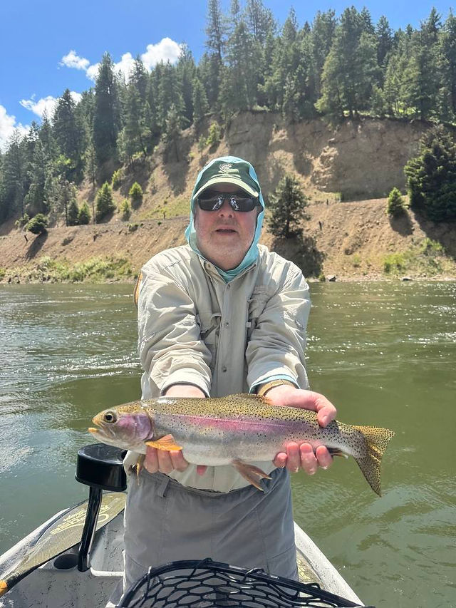 Dave with a chunky rainbow caught on the Clark fork river 