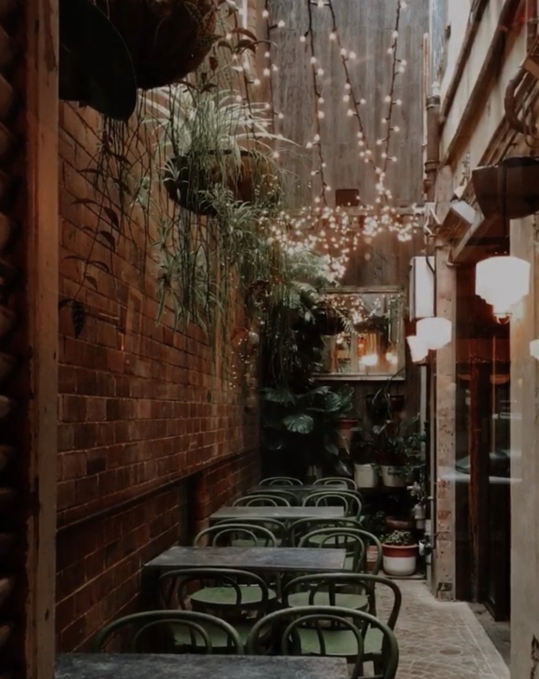 Belgrave Cartel outdoor courtyard — sunny cafe by day, candlelit Italian restaurant by night